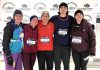 Peterborough Regional Health Centre emergency physician Dr. Terry May (centre) and his wife Chris Ferguson (far left) and their children participating in a five-kilometre run in December 2024. (Photo courtesy of the May Family)