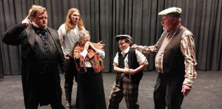 Trent Valley Archives Theatre's play "Crossing Over" is a fictionalized account of the cross-Atlantic journey of the John Barry, one of the nine emigrant transport ships that brough over 2,000 Irish settlers to the Peterborough region 200 years ago. In this scene from a play rehearsal, John Keleher (Hugh Foley, right) brings petty thief Tim Ryan (Kaza Hesselink, second from right) to the ship's surgeon and superintendent William Burnie (Ashley Parker, left) for shipboard justice as Mr. and Mrs. Hagarty (Lucas Pronk and Cathy Brand) look on with worry, as they have secrets of their own to keep. (Photo courtesy of Trent Valley Archives Theatre)