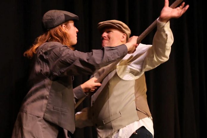 In a scene from a rehearsal of Trent Valley Archives Theatre's play "Crossing Over", Patrick Ryan (Nathan Govier, right) struggles to prevent a panicking Mr. Hagarty (Lucas Pronk) from leaving the John Barry in a lifeboat. (Photo courtesy of Trent Valley Archives Theatre)