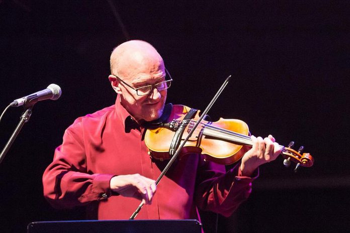 In From The Cold co-founder John Hoffman performing on fiddle at Market Hall Performing Arts Centre in Peterborough in December 2015. (Photo: Linda McIlwain / kawarthaNOW)