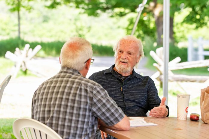 kawarthaNOW's Paul Rellinger speaks with Ian McLachlan, who co-wrote "The Housekeeper" with Robert Winslow at a media day hosted by 4th Line Theatre on June 18, 2025 at the Winslow Farm in Millbrook. The fourth in a series about the Barnardo children written by Winslow and McLachlan, the play runs for 14 performances from July 1 to 19. (Photo: Jordan Lyall Photography for kawarthaNOW)
