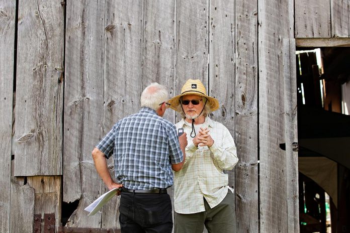 kawarthaNOW's Paul Rellinger speaks with 4th Line Theatre founder Robert Winslow, who co-wrote "The Housekeeper" with Ian McLachlan, at a media day hosted by 4th Line Theatre on June 18, 2025 at the Winslow Farm in Millbrook. Winslow is also directing the play, which runs for 14 performances from July 1 to 19. (Photo: Jordan Lyall Photography for kawarthaNOW)