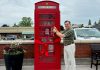 Municipality of Brighton Mayor Brian Ostrander cuts the ribbon on a British-style telephone booth installed in the downtown core, which serves as both a tourist information kiosk and a backdrop for photos. A local business purchased the phone booth from a private owner and donated to the municipality. (Photo: Municipality of Brighton)