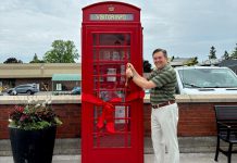 Municipality of Brighton Mayor Brian Ostrander cuts the ribbon on a British-style telephone booth installed in the downtown core, which serves as both a tourist information kiosk and a backdrop for photos. A local business purchased the phone booth from a private owner and donated to the municipality. (Photo: Municipality of Brighton)