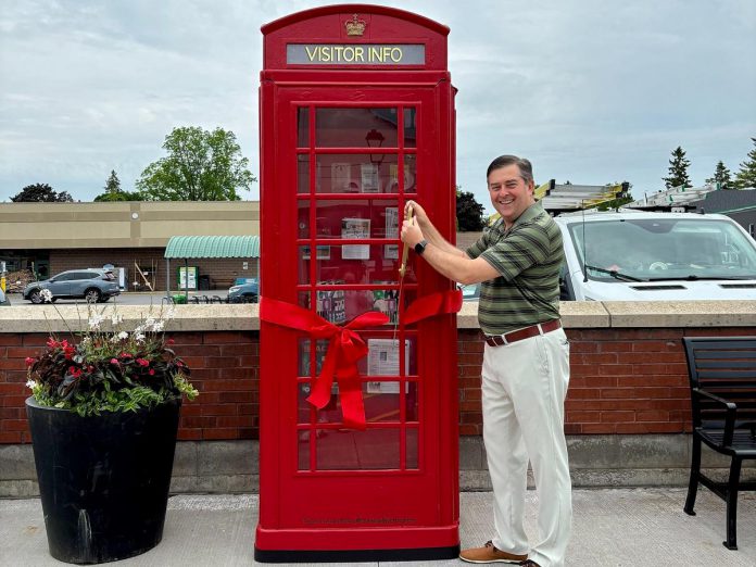 Municipality of Brighton Mayor Brian Ostrander cuts the ribbon on a British-style telephone booth installed in the downtown core, which serves as both a tourist information kiosk and a backdrop for photos. A local business purchased the phone booth from a private owner and donated to the municipality. (Photo: Municipality of Brighton) Municipality of Brighton Mayor Brian Ostrander cuts the ribbon on a British-style telephone booth installed in the downtown core, which serves as both a tourist information kiosk and a backdrop for photos. A local business purchased the phone booth from a private owner and donated to the municipality. (Photo: Municipality of Brighton)