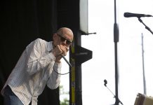 Award-winning virtuoso harmonica player Carlos del Junco will be performing with his band The Blue Mongrels as a quartet at the Lakefield Jazz, Art & Craft Festival at Isobel Morris Park on July 12, 2025. (Photo via Carlos del Junco website)