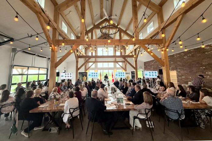 Community Futures Peterborough's executive director Devon Girard speaks to the audience at the economic development organization's annual general meeting on June 26, 2025 at Farmhill Weddings in Keene. The economic development organization is celebrating 40 years of providing financing and advice and support to small businesses in the city and county of Peterborough. (Photo courtesy of Community Futures Peterborough) Community Futures Peterborough's executive director Devon Girard speaks to the audience at the economic development organization's annual general meeting on June 26, 2025 at Farmhill Weddings in Keene. The economic development organization is celebrating 40 years of providing financing and advice and support to small businesses in the city and county of Peterborough. (Photo courtesy of Community Futures Peterborough)