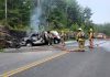 Fire crews extinguished a commercial vehicle carrying oxygen bottles after it left County Road 503 near Kinmount on June 17, 2025 and struck a rock cut, later catching on fire. (Photo: Peterborough County OPP)