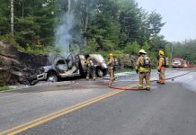 Fire crews extinguished a commercial vehicle carrying oxygen bottles after it left County Road 503 near Kinmount on June 17, 2025 and struck a rock cut, later catching on fire. (Photo: Peterborough County OPP)