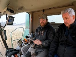 Chris Brackenridge of Squirrel Creek Farm teaches Millbrook resident David McNab about farming for a video about the farmers' way of life and the challenges they face. What began with a kind gesture from the Brackenridge family to visiting farmers from the Galapagos Islands led to McNab filming four seasons' worth of footage on the farm. The footage was recently sold to the Ontario Federation of Agriculture for enough money to support six years of school for the 12-year-old son of a female farmer in Kenya that McNab has been sponsoring. (kawarthaNOW screenshot of David McNab video)