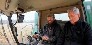 Chris Brackenridge of Squirrel Creek Farm teaches Millbrook resident David McNab about farming for a video about the farmers' way of life and the challenges they face. What began with a kind gesture from the Brackenridge family to visiting farmers from the Galapagos Islands led to McNab filming four seasons' worth of footage on the farm. The footage was recently sold to the Ontario Federation of Agriculture for enough money to support six years of school for the 12-year-old son of a female farmer in Kenya that McNab has been sponsoring. (kawarthaNOW screenshot of David McNab video)
