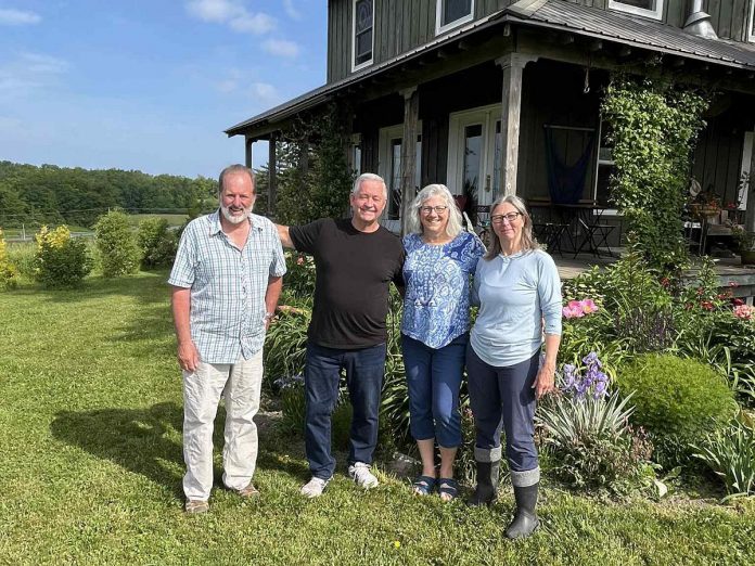 In 2023, Millbrook beef farmers David Kennedy (left) and Catherine Ives (right), pictured with David McNab and Kristy Hiltz, held a calf-naming contest at their farm to help a Kenyan farmer pay for her adopted son's schooling. (Photo courtesy of David McNab)