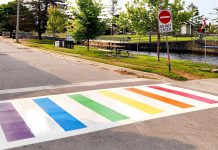 The first-ever Pride-coloured crosswalk in Fenelon Falls has been installed at the intersection of May and Water streets, an initiative of the City of Kawartha Lakes, the Fenelon Falls & District Chamber of Commerce, community residents, and local businesses and organizations. (Photo: Julia Taylor / Facebook)
