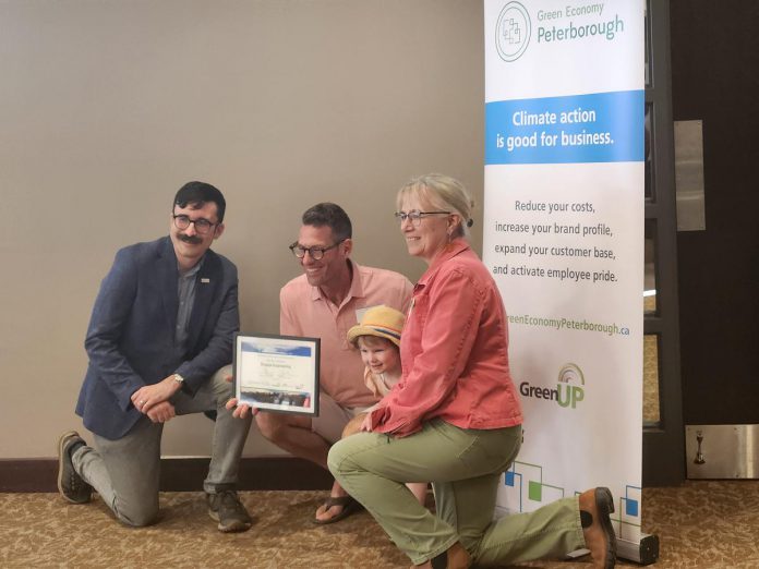 Globally, communities, countries and businesses are committing to necessary net zero emissions reduction by 2050 or sooner. At GreenUP Green Economy Peterborough's 2025 Leadership in Sustainability Awards on June 12, Engage Engineering joined Peterborough-area leaders Woodleigh Farms, Unity Design Studio, and Wild Rock Outfitters in committing to following the global lead. Many of these businesses are already carbon neutral through recent reductions and the purchasing of offsets. Pictured here is Paul Hurley of Engage Engineering, which received recognition for their recent commitment to become Net Zero. (Photo: Hayley Goodchild / GreenUP) Globally, communities, countries and businesses are committing to necessary net zero emissions reduction by 2050 or sooner. At GreenUP Green Economy Peterborough's 2025 Leadership in Sustainability Awards on June 12, Engage Engineering joined Peterborough-area leaders Woodleigh Farms, Unity Design Studio, and Wild Rock Outfitters in committing to following the global lead. Many of these businesses are already carbon neutral through recent reductions and the purchasing of offsets. Pictured here is Paul Hurley of Engage Engineering, which received recognition for their recent commitment to become Net Zero. (Photo: Hayley Goodchild / GreenUP)