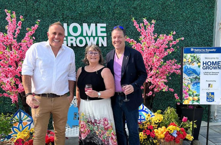 "HomeGrown: A Habitat Vineyard Party Fundraiser" on June 7, 2025 at Rolling Grape Vineyards in Bailieboro raised $24,000 for Habitat for Humanity Peterborough & Kawartha Region (Habitat PKR). Pictured is event host Neil Morton of Cormor Inc. with Habitat PKR CEO Susan Zambonin and her husband and Habitat PKR procurement manager Mario Zambonin. (Photo courtesy of Habitat PKR)