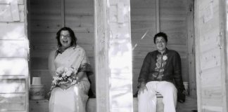 Literally and figuratively in the "out" house at their 2006 wedding on the Haida Gwaii islands in British Columbia, Peterborough healthcare professionals Sheena Howard and Vanita Lokanathan were among the first same-sex couples in Canada to be legally married. Today, the couple share why Pride Month celebrations are so important for showing solidarity and providing a safe space for LGBTQ+ people. (Photo courtesy of Sheena Howard and Vanita Lokanathan)