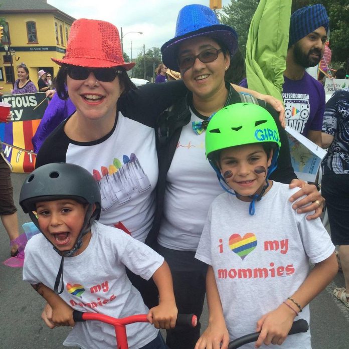 Peterborough healthcare professionals Sheena Howard and Vanita Lokanathan at a past Peterborough Pride parade with their then-young sons Balan and Ashwyn. For the couple, Pride events are important for giving LGBTQ+ community members the chance to "let their shoulders down" and feel the safety and inclusivity that others who don't belong to marginalized groups feel on a daily basis. (Photo courtesy of Sheena Howard and Vanita Lokanathan)