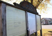 In summer 2025, the Township of Selwyn will be revitalizing this aging visitor information kiosk in Lakefield's Cenotaph Park, as well as kiosks in Bridgenorth and Ennismore, with updated branding and maps, improved accessibility, modern and weather-resident materials, and visually engaging layouts showcasing local points of interest, services, and annual events. (Photo: Selwyn Township)