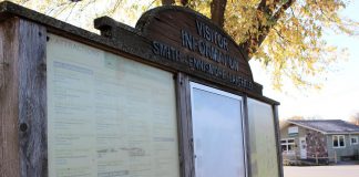 In summer 2025, the Township of Selwyn will be revitalizing this aging visitor information kiosk in Lakefield's Cenotaph Park, as well as kiosks in Bridgenorth and Ennismore, with updated branding and maps, improved accessibility, modern and weather-resident materials, and visually engaging layouts showcasing local points of interest, services, and annual events. (Photo: Selwyn Township)