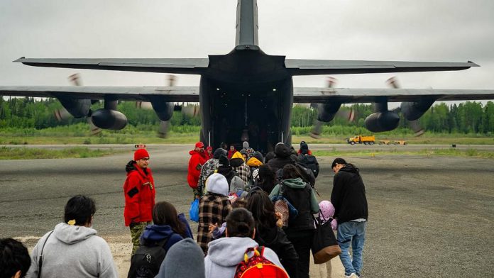Members of Sandy Lake First Nation in northwestern Ontario have been flown out of the community on Hercules aircraft due to nearby wildfire Red Lake 12. (Photo: Nicholas Zahari / Department of National Defence) Members of Sandy Lake First Nation in northwestern Ontario have been flown out of the community on Hercules aircraft due to nearby wildfire Red Lake 12. (Photo: Nicholas Zahari / Department of National Defence)