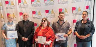 The recipients of the Peterborough Arts Awards on June 12, 2025 at the Canadian Canoe Museum: Rebecca Birrell for her father Syd Birrell (Outstanding Senior Artist), David Goyette (Arts Champion), Lynda Todd (Outstanding Emerging Artist), Chad Hogan (Arts Catalyst), and Olivia Whetung (Outstanding Mid-Career Artist). Not pictured is Sarah Decarlo (Outstanding Achievement by an Indigenous Artist). Each award winner received $2,000 and a pin created by local artists Christy Haldane and Valerie Davidson. (Photo courtesy of Electric City Culture Council)
