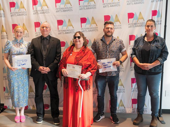 The recipients of the Peterborough Arts Awards on June 12, 2025 at the Canadian Canoe Museum: Rebecca Birrell for her father Syd Birrell (Outstanding Senior Artist), David Goyette (Arts Champion), Lynda Todd (Outstanding Emerging Artist), Chad Hogan (Arts Catalyst), and Olivia Whetung (Outstanding Mid-Career Artist). Not pictured is Sarah Decarlo (Outstanding Achievement by an Indigenous Artist). Each award winner received $2,000 and a pin created by local artists Christy Haldane and Valerie Davidson. (Photo courtesy of Electric City Culture Council) The recipients of the Peterborough Arts Awards on June 12, 2025 at the Canadian Canoe Museum: Rebecca Birrell for her father Syd Birrell (Outstanding Senior Artist), David Goyette (Arts Champion), Lynda Todd (Outstanding Emerging Artist), Chad Hogan (Arts Catalyst), and Olivia Whetung (Outstanding Mid-Career Artist). Not pictured is Sarah Decarlo (Outstanding Achievement by an Indigenous Artist). Each award winner received $2,000 and a pin created by local artists Christy Haldane and Valerie Davidson. (Photo courtesy of Electric City Culture Council)