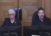 Peterborough city councillors Joy Lachica and Alex Bierk during a city council meeting on June 9, 2025 when council voted 6-4 in favour of not imposing a penalty on Mayor Jeff Leal for breaching council's code of conduct after the City of Peterborough's integrity commissioner issued a report that found the mayor had intimidated Bierk and bullied Lachica in relation to council discussions about the controversial Bonnerworth Park redevelopment in April 2024. (kawarthaNOW screenshot of City of Peterborough video)