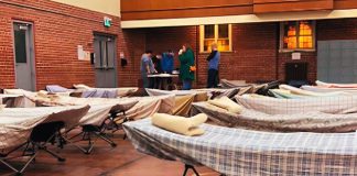 Staff at Trinity Centre in Peterborough preparing to open its overnight drop-in program. (Photo: Trinity Centre 2024-25 annual report)