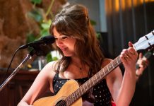 The Peterborough Folk Festival's 2025 Emerging Artist Award winner Jeanne Truax performing at Jethro's Bar + Stage in downtown Peterborough in February 2024. The 22-year-old singer-songwriter, guitarist, and keyboardist released her debut single "I Know What Your Like" in May 2025 with the help of her brother Nathan, who won the Emerging Artist Award in 2022. (Photo: Andy Carroll)
