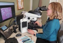 Dr. Katie O'Reilly, pathologist and medical director of laboratory medicine at Peterborough Regional Health Centre (PRHC), examines a tissue sample. The PRHC Foundation has made it a priority to invest in the future of cancer care by bringing digital pathology to the regional hospital, with the help of donors. An area of focus for the Foundation's $60 million Campaign for PRHC, the state-of-the-art technology will produce efficient and more accurate diagnoses, reduce turnaround time, and empower world-class healthcare close to home. (Photo courtesy of PRHC Foundation)