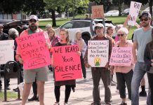 Some of the signs held by a crowd of around 75 people attending the "Rally for Integrity" outside of Peterborough City Hall on June 9, 2025, urging city councillors to hold Mayor Jeff Leal to account for breaching council's code of conduct by intimidating councillor Alex Bierk and then bullying councillor Joy Lachica as reported by the city's integrity commissioner. (Photo: Jeannine Taylor / kawarthaNOW)