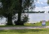 Peterborough Public Health closed the beach at Rogers Cove in Peterborough's East City in July 2023 after a harmful blue-green algae bloom was confirmed. For summer 2025, the health unit will no longer be testing the water quality at the beach, and the City of Peterborough will no longer be providing lifeguard services. (Photo: Bruce Head / kawarthaNOW)