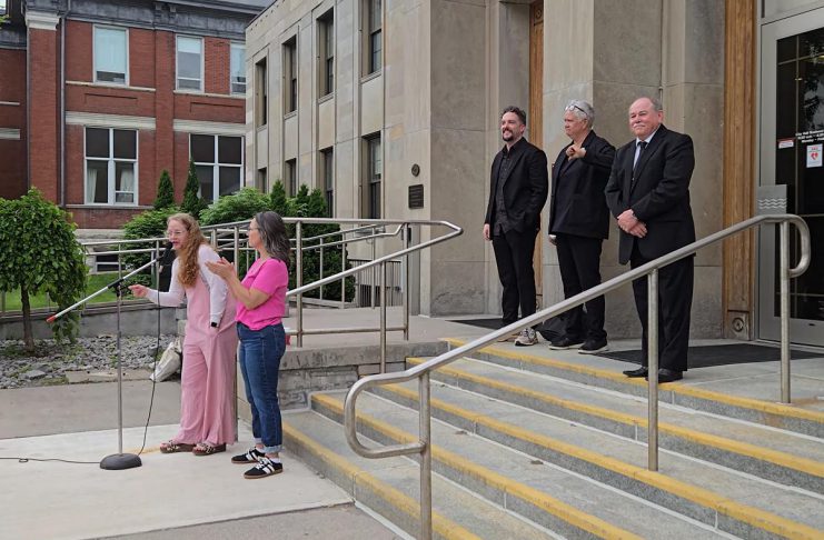 ‘We’re devastated’: neighbourhood group abandons legal case against City of Peterborough after court demands $30K upfront Sarah McNeilly, the sole director of Northcrest Neighbours for Fair Process (NNFP) Ltd., spoke to a crowd outside of Peterborough city hall on June 9, 2025 during the "Rally for Integrity" in support of councillors Alex Bierk and Joy Lachica (pictured with councillor Keith Riel), who the city's integrity commissioner found were intimidated and bullied by Mayor Jeff Leal. McNeilly spoke about NNFP's legal challenge against Leal's use of strong mayor powers to expedite the development of Brock Mission's proposed six-storey transitional housing building by exempting it from site plan requirements. (Photo: Jeannine Taylor / kawarthaNOW)