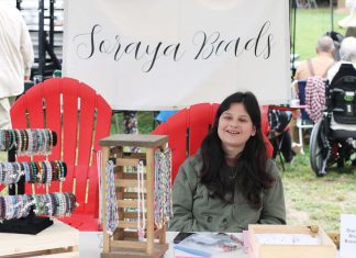 19-year-old Curve Lake First Nation artist Soraya Whetung of Soraya Beads selling her handmade jewellery at the 71st annual Curve Lake Pow Wow in September 2024. Her handmade beaded bracelets will soon be available for purchase through Canadian off-price department store chain Winners. (Photo courtesy of Soraya Whetung)