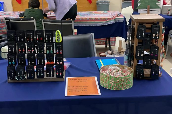 Though Soraya Whetung initially taught herself how to bead just for her own enjoyment, it quickly grew into a small business after she posted photos of her jewellery on social media and began selling her work at shows like the Curve Lake Christmas market in 2023. The 19-year-old artist says it's "surreal" to see people walking around wearing her handmade bracelets, earrings, and necklaces. (Photo courtesy of Soraya Whetung)