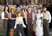 "Wild Irish Geese" playwright and actor Megan Murphy and director Kim Blackwell (left) on July 16, 2025 with some of the cast of 29 professional and volunteer actors/musicians who are performing in the world premiere play at 4th Line Theatre that tells the story of the Peter Robinson emigration of Irish settlers in 1825: Jasper Chesser (third from left), M. John Kennedy (behind Jasper), Paul Crough, Darragh O'Connell, Lindsay Wilson, Indigo Chesser, Sebastian Sage (behind Indigo), and Padrick Wilson. The play runs from July 29 to August 30 at the Winslow Farm in Millbrook. (Photo: Jordan Lyall Photography for kawarthaNOW)
