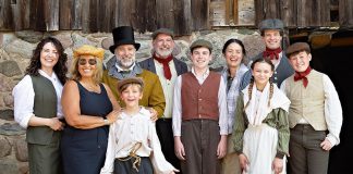 "Wild Irish Geese" playwright and actor Megan Murphy and director Kim Blackwell (left) on July 16, 2025 with some of the cast of 29 professional and volunteer actors/musicians who are performing in the world premiere play at 4th Line Theatre that tells the story of the Peter Robinson emigration of Irish settlers in 1825: Jasper Chesser (third from left), M. John Kennedy (behind Jasper), Paul Crough, Darragh O'Connell, Lindsay Wilson, Indigo Chesser, Sebastian Sage (behind Indigo), and Padrick Wilson. The play runs from July 29 to August 30 at the Winslow Farm in Millbrook. (Photo: Jordan Lyall Photography for kawarthaNOW)