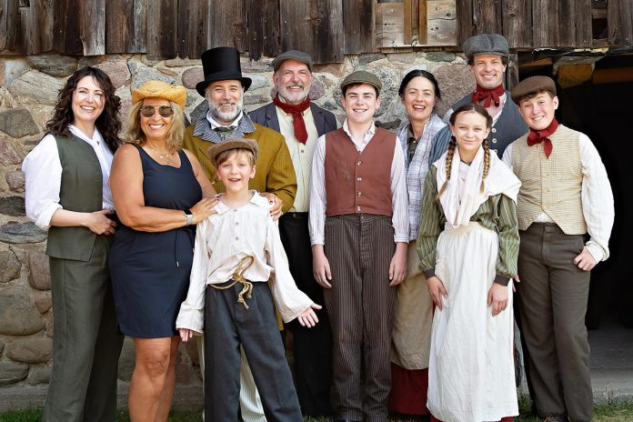 "Wild Irish Geese" playwright and actor Megan Murphy and director Kim Blackwell (left) on July 16, 2025 with some of the cast of 29 professional and volunteer actors/musicians who are performing in the world premiere play at 4th Line Theatre that tells the story of the Peter Robinson emigration of Irish settlers in 1825: Jasper Chesser (third from left), M. John Kennedy (behind Jasper), Paul Crough, Darragh O'Connell, Lindsay Wilson, Indigo Chesser, Sebastian Sage (behind Indigo), and Padrick Wilson. The play runs from July 29 to August 30 at the Winslow Farm in Millbrook. (Photo: Jordan Lyall Photography for kawarthaNOW) "Wild Irish Geese" playwright and actor Megan Murphy and director Kim Blackwell (left) on July 16, 2025 with some of the cast of 29 professional and volunteer actors/musicians who are performing in the world premiere play at 4th Line Theatre that tells the story of the Peter Robinson emigration of Irish settlers in 1825: Jasper Chesser (third from left), M. John Kennedy (behind Jasper), Paul Crough, Darragh O'Connell, Lindsay Wilson, Indigo Chesser, Sebastian Sage (behind Indigo), and Padrick Wilson. The play runs from July 29 to August 30 at the Winslow Farm in Millbrook. (Photo: Jordan Lyall Photography for kawarthaNOW)