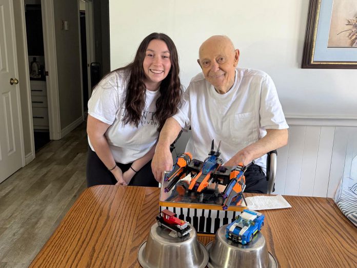 Trent University social work graduate Kellie Dowdall, an in-home recreation therapy volunteer with the Alzheimer Society of Peterborough, Kawartha Lakes, Northumberland, and Haliburton, joined Bob at his home for at least one hour per week since the fall of 2024 to engage in a number of social activities, including building with LEGO blocks. The in-home recreation therapy program is just one of the many flexible opportunities available for people who are interested in volunteering with the organization that supports people living with Alzheimer's disease and other forms of dementia and their families. (Photo courtesy of Alzheimer Society PKLNH) Trent University social work graduate Kellie Dowdall, an in-home recreation therapy volunteer with the Alzheimer Society of Peterborough, Kawartha Lakes, Northumberland, and Haliburton, joined Bob at his home for at least one hour per week since the fall of 2024 to engage in a number of social activities, including building with LEGO blocks. The in-home recreation therapy program is just one of the many flexible opportunities available for people who are interested in volunteering with the organization that supports people living with Alzheimer's disease and other forms of dementia and their families. (Photo courtesy of Alzheimer Society PKLNH)