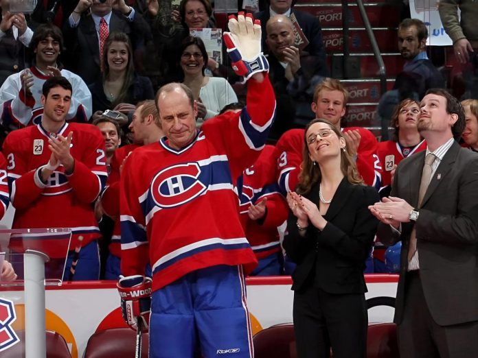 As his number 23 jersey is retired during a NHL pre-game ceremony in Montreal on February 23, 2008, Montreal Canadiens general manager and Peterborough native Bob Gainey waves beside his daughter Anna and her husband Tom Pitfield. Gainey won five Stanley Cups during his career as well as the Conn Smythe Trophy as most valuable player of the playoffs in 1979. (Photo: Andre Ringuette)
