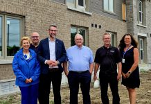 Officials from the Ontario government and the City of Kawartha Lakes gathered at a housing development in Fenelon Falls as part of an announcement of $1,442,307 in funding for the municipality through the province's "Building Faster Fund" after the municipality broke ground on 451 new homes last year, representing 83 per cent of its 2024 housing target. From left to right: Haliburton-Kawartha Lakes-Brock MPP Laurie Scott, Kawartha Lakes councillor Mike Perry, Municipal Affairs and Housing Minister parliamentary assistant Matthew Rae, Kawartha Lakes mayor Doug Elmslie, Kawartha Lakes building and property housing manager Don Quibell, and Kawartha Lakes human services director Cheryl Faber. (Photo: City of Kawartha Lakes)