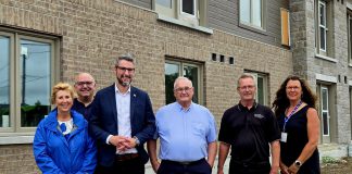Officials from the Ontario government and the City of Kawartha Lakes gathered at a housing development in Fenelon Falls as part of an announcement of $1,442,307 in funding for the municipality through the province's "Building Faster Fund" after the municipality broke ground on 451 new homes last year, representing 83 per cent of its 2024 housing target. From left to right: Haliburton-Kawartha Lakes-Brock MPP Laurie Scott, Kawartha Lakes councillor Mike Perry, Municipal Affairs and Housing Minister parliamentary assistant Matthew Rae, Kawartha Lakes mayor Doug Elmslie, Kawartha Lakes building and property housing manager Don Quibell, and Kawartha Lakes human services director Cheryl Faber. (Photo: City of Kawartha Lakes)