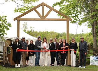 Samantha Perry cut the ribbon alongside her parents Mike and Linda Belsey at a ceremony on May 30, 2025 to celebrate the start of the first full season of Pondview Estates. In partnership with Perry's business Samantha Ann & Co., the elevated do-it-yourself wedding venue in the Township of Asphodel-Norwood makes it a priority to work with other local wedding vendors, who they also celebrate through social media promotion and by hosting an annual open house and vendor market. (Photo: Shannon FC Photography)