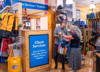 Rob Arkell, mission leader for the Wild Again initiative at Wild Rock Outfitters in downtown Peterborough, accepts a used item at the trade-in desk, where customers can keep high-quality products in circulation by trading in their used merchandise for store credit. This credit can be used to purchase new or used products, or the trade-in value can be donated to the organization's ComPassion Project. (Photo: Jeff Faulds / Wild Rock Outfitters)