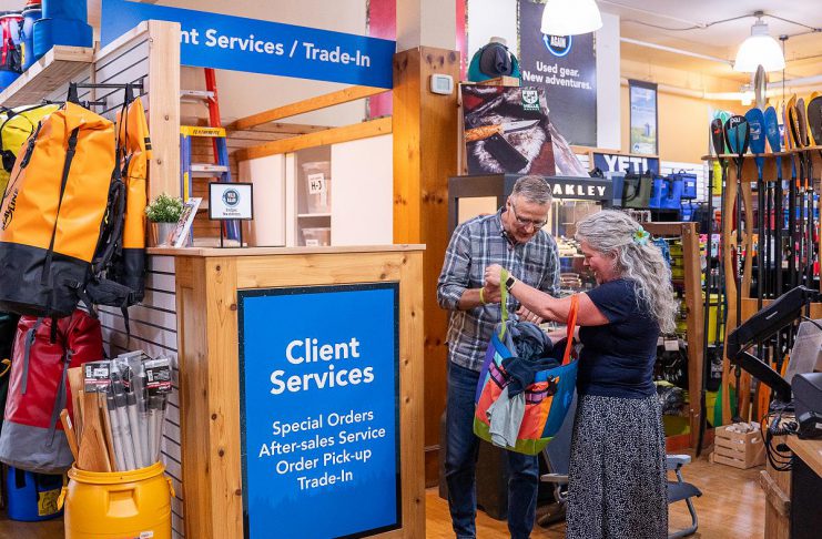 From outdoor gear to farm soil, Peterborough businesses put the circular economy into practice Rob Arkell, mission leader for the Wild Again initiative at Wild Rock Outfitters in downtown Peterborough, accepts a used item at the trade-in desk, where customers can keep high-quality products in circulation by trading in their used merchandise for store credit. This credit can be used to purchase new or used products, or the trade-in value can be donated to the organization's ComPassion Project. (Photo: Jeff Faulds / Wild Rock Outfitters)