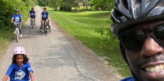 Trent Health in Motion co-owners Michael Williams and Reanna Montopoli cycling with their family and colleagues during a cycling event in June. The Peterborough health and wellness clinic has sponsored the GreenUP 2025 Summer Ride Club's grand prize with a $500 gift card to any local bike shop. (Photo: Micheal Williams / Trent Health in Motion)