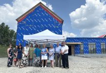 Provincial and municipal politicians and healthcare representatives gathered at the Summit Wellness Centre under construction in Coboconk on July 15, 2025 for an announcement of $3,493,400 in funding from the Ontario government to the Kawartha Lakes Haliburton Ontario Health Team for the Kawartha North Family Health Team to expand interprofessional primary care teams to Coboconk, Woodville, and Minden so that up to 6,902 people have access to primary healthcare. (Photo: City of Kawartha Lakes)