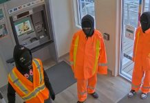 Three male suspects in the atrium of the Kawartha Credit Union branch at 4088 County Rd 121 in Kinmount on June 30, 2025. (Police-supplied photo)