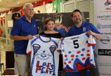 A fundraiser for Five Counties Children's Centre, Little Lakers Night returns to the Peterborough Memorial Centre on July 24, 2025 when the Peterborough Century 21 Lakers take on the Brampton Excelsiors in their final home game of the regular Major Series Lacrosse season. Pictured during a media event on July 15 are Lakers board chair Len Powers (left) and Five Counties CEO Scott Pepin (right) with nine-year-old Kennedy Meredith, who designed the special jersey that Lakers players will wear during the pre-game warmup before being auction off in support of Five Counties. (Photo: Peterborough Century 21 Lakers)