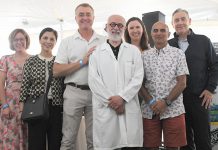 Cobourg real estate agent Tony Pulla, a longtime signature sponsor of Northumberland Hills Hospital Foundation's "Wine & Ale in the Park" fundraiser in Cobourg and supporter of the foundation for more than 20 years, was presented with a white "Doctor of Philanthropy" jacket during the event on June 26, 2025 at Cobourg's Victoria Park, which raised a record $42,000 for the foundation. (Photo: Northumberland Hills Hospital Foundation / Facebook)